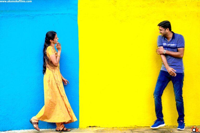 Couple Playing with each other in the different painted background wall